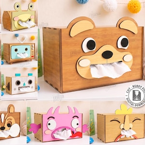 Peut inclure: Une collection de dix boîtes à mouchoirs en bois découpées au laser présentant divers motifs d'animaux et de personnages. Chaque boîte possède une ouverture centrale pour distribuer les mouchoirs. Fichiers numériques pour matériau de 3mm.
