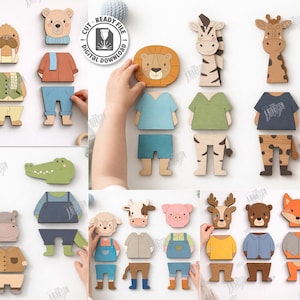 May include: Wooden animal puzzles with interchangeable clothing. The set includes a penguin, walrus, bear, lion, zebra, giraffe, elephant, crocodile, hippo, sheep, cow, pig, deer, bear, and fox. The image also includes the text "CUT READY FILE DIGITAL DOWNLOAD".