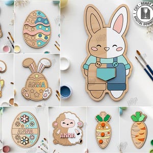 Puede incluir: Una colección de 10 diseños de Pascua cortados con láser, que incluyen conejos, huevos, un pollito, un cordero, una cesta y zanahorias. Los diseños de madera están pintados en varios colores. Algunos diseños tienen el nombre "ANNA". El texto "CUT READY FILE" también está presente.