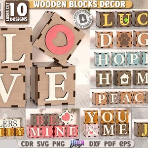 Könnte beinhalten: Holzblock-Dekoration mit lasergeschnittenen Designs. Das Bild zeigt verschiedene Blöcke, die Wörter wie "LOVE", "LUCK", "HOPE" und "JOY" buchstabieren. Die Blöcke bestehen aus hellem Holz mit weißen oder farbigen Akzenten. Der Text "6MM 1/4 IN" ist sichtbar.