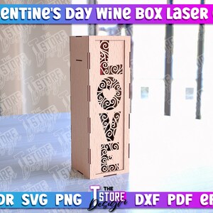 May include: A wooden wine box with a laser cut design of the word "LOVE" with decorative swirls and a heart. The box is made for a standard size wine bottle.