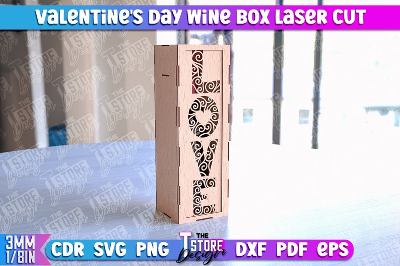 May include: A wooden wine box with a laser cut design of the word "LOVE" with decorative swirls and a heart. The box is made for a standard size wine bottle.
