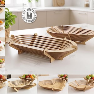 Op de afbeelding: Een collectie van tien lasergesneden houten fruitmanden in diverse vormen, waaronder ovale, rechthoekige en hartvormige ontwerpen. De digitale downloadbestanden zijn compatibel met CDR, SVG, PNG, DXF, PDF en EPS voor 3mm materiaaldikte.