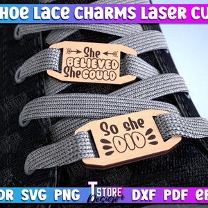 May include: Two wooden shoe lace charms with inspirational text. The top charm reads "She Believed She Could" and the bottom charm reads "So She Did".