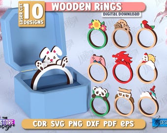 May include: A collection of ten laser-cut wooden rings with various designs, including a bunny, panda, and dragon. The rings are displayed in a blue box, with the text "WOODEN RINGS" and "DIGITAL DOWNLOAD". The image also includes file format options.