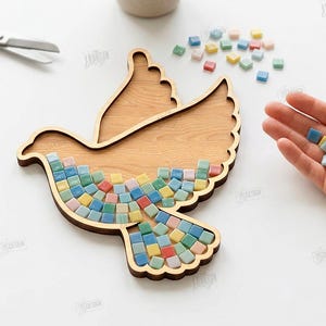 May include: A wooden dove-shaped mosaic base with colorful square tiles. The dove is made of light brown wood, and the mosaic tiles are in shades of blue, green, yellow, and red. The image also shows scissors and the text "CUT READY FILE DIGITAL DOWNLOAD".