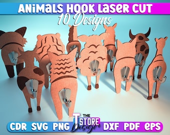 Puede incluir: Diez ganchos de animales de madera cortados con láser en varios diseños, incluyendo un zorro, una oveja, una vaca y una jirafa. Los ganchos están pintados de marrón y tienen un gancho de metal plateado unido a la parte posterior.