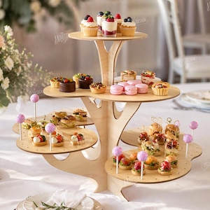 May include: A multi-tiered wooden dessert stand displaying various miniature pastries, cupcakes, and appetizers. The stand has a tree-like design and is filled with colorful treats. The text "CUT READY FILE DIGITAL DOWNLOAD" is visible.