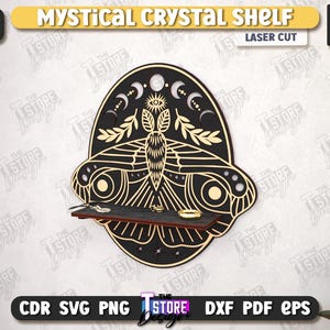 May include: A black and gold laser-cut Mystical Crystal Shelf in the shape of a moth. The shelf is 1/4 inch thick and has a small shelf to hold crystals or other small items. The design includes moons, stars, and an eye.
