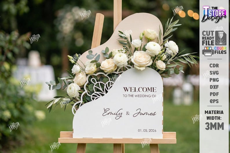 May include: A white welcome sign for a wedding, shaped like a piano, with floral arrangements and the names "Emily & James" and the date "01.05.2026". The sign is on a wooden easel.