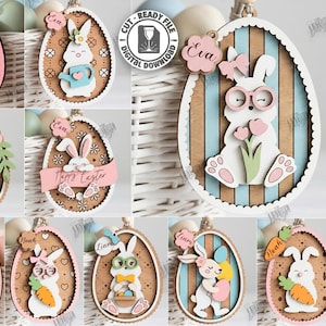 May include: A collection of laser-cut Easter egg ornaments featuring bunny designs. Each ornament is made of wood and includes a bunny with various accessories, such as carrots, flowers, and glasses. The ornaments are designed for laser cutting and are compatible with any material thickness.