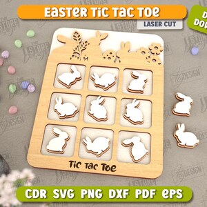 May include: A wooden Easter tic-tac-toe game featuring bunny silhouettes. The game board has nine squares, each containing a bunny silhouette. The board is surrounded by a decorative border with flowers and bunnies. The text "Tic Tac Toe" is printed on the board.