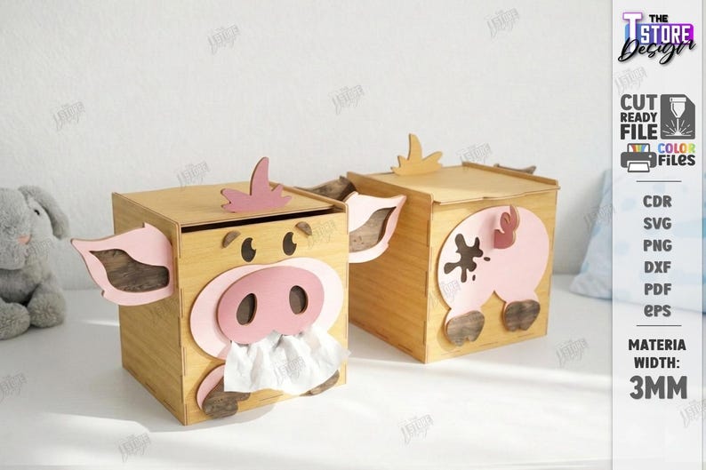 May include: Two wooden tissue box covers shaped like pigs. Each box has a light brown finish with pink accents for the ears, snout, and tail. One pig has a tissue sticking out of its snout. The boxes are 3mm wide.