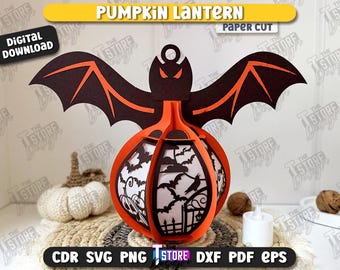 May include: A paper cut pumpkin lantern with bat wings and a bat head. The orange and black lantern has a detailed design with bats and a fence. The words "PUMPKIN LANTERN" and "DIGITAL DOWNLOAD" are visible.
