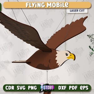 May include: A laser-cut wooden eagle mobile with outstretched wings, featuring brown and white coloring, and a yellow beak. The text "FLYING MOBILE" and "LASER CUT" are displayed. The image also includes the text "AGEN TOTO MACAU DOWNLOAD" and file type options.