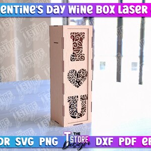 May include: A laser cut wooden wine box with a decorative "I Love You" design. The box is made of light brown wood and has a cutout of the letters "I", "Love", and "You" with a floral pattern.