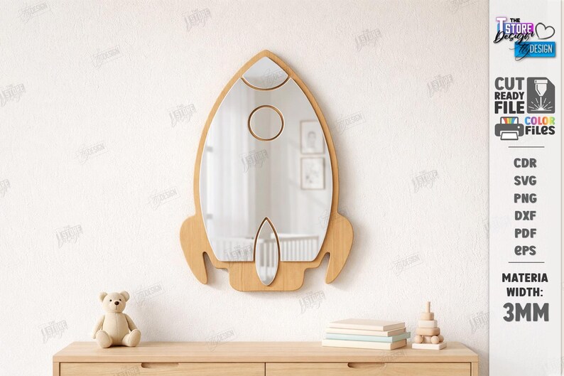 May include: A wooden rocket-shaped mirror with a clear reflective surface. The mirror has a light brown frame with cut-out details and a circular and oval shape. The text "CUT READY FILE" and "MATERIAL WIDTH: 3MM" are visible.