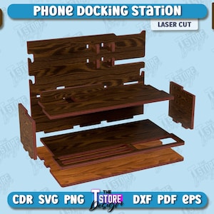 Op de afbeelding: Een gedemonteerde telefoon docking station gemaakt van hout. De station is gemaakt van zes stukken, elk met een houtnerfpatroon. De stukken zijn gelabeld met de tekst "6MM 1/4 IN" en "LASER CUT".