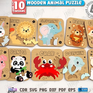 May include: Ten wooden animal puzzles, each depicting a different animal. The puzzles include a bunny, lion, elephant, bear, fox, pig, panda, crab, dolphin, and cat. Each puzzle is laser cut and has a unique shape, with measurements in cm.