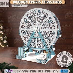 Puede incluir: Una decoración navideña de noria de madera cortada con láser. La noria es blanca con intrincados diseños recortados y soportes azul claro. El texto "3MM WOODEN FERRIS CHRISTMAS LASER CUT" está en la parte superior.