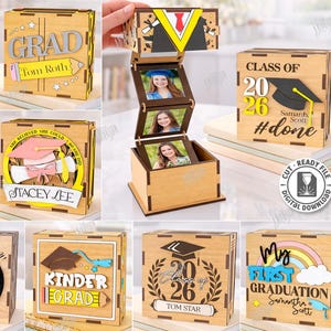 May include: Wooden graduation boxes with laser-cut designs. The boxes feature the words "Grad," "2026," and names. Some boxes have a mortarboard, diploma, and a rainbow. The boxes are ready to assemble and are 3mm in width.