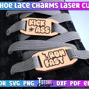 May include: Two laser cut wooden shoe lace charms. The first charm is brown and says "Kick *Ass". The second charm is brown and says "Run Fast".