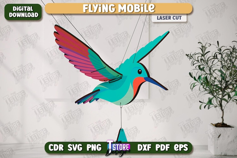 May include: A laser-cut hummingbird mobile with teal, red, and purple wings. The mobile is suspended by strings and features the text "FLYING MOBILE" and "LASER CUT". The image also includes the text "AGEN TOTO MACAU DOWNLOAD" and file type options.