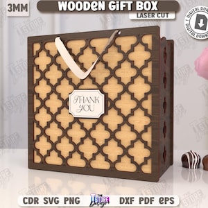 May include: A laser-cut wooden gift box with a decorative geometric pattern. The box is brown with a light-colored interior and a white handle. A small label reads "Thank You". The image also includes the text "Wooden Gift Box" and "Digital Download".