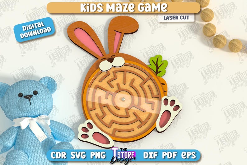 May include: A wooden laser-cut kids' maze game shaped like a bunny with a carrot. The maze is circular with a clear cover. The bunny has pink ears and feet. The text "Kids Maze Game" and "Laser Cut" are visible.