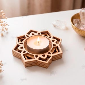 May include: A light-colored wooden tea light candle holder featuring a layered, geometric lotus flower design. The holder contains a single white tea light candle. Text on the right side reads: CUT READY FILE DIGITAL DOWNLOAD CDR SVG PNG DXF PDF EPS.