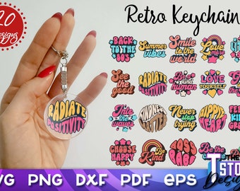 May include: Twenty retro keychain designs featuring colorful, groovy text phrases like "Radiate Positivity", "See the Good", "Be a Kind Human", "Love Yourself", "Grow with the Flow", "Never Stop Trying", "Hippie Heart", "Feelin' Kinda Groovy", "Boss Babe", and "Be the Peachy".