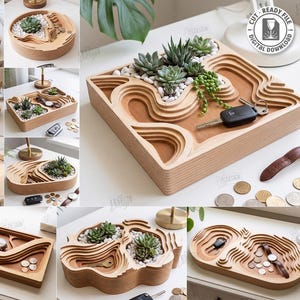 Puede incluir: Una colección de diez bandejas de madera cortadas con láser con diseños topográficos en capas. Estas bandejas sirven como organizadores para objetos pequeños como llaves, monedas y relojes, o como macetas para suculentas sobre piedras blancas.
