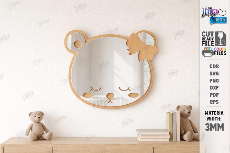May include: A bear-shaped mirror with a wooden frame and bow, featuring closed eyes and a nose. The mirror is mounted on a white wall. The text "CUT READY FILE" and "COLOR FILES" is visible. The material width is 3mm.