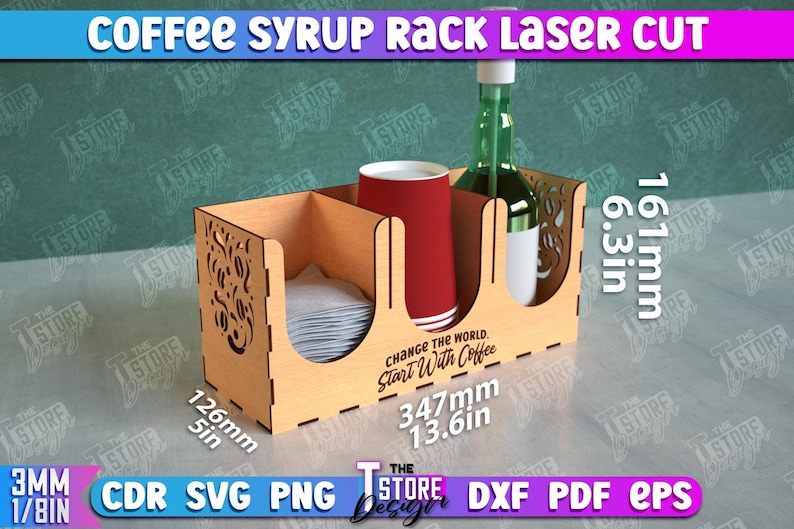 May include: A wooden coffee syrup rack with a laser cut design. The rack has three compartments, one for a bottle of syrup, one for a cup, and one for napkins. The rack is 13.6 inches wide, 6.3 inches tall, and 5 inches deep. The rack has the text "Change the world. Start with coffee." printed on the front.