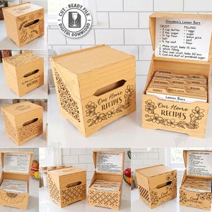 May include: Wooden recipe box with laser-cut floral and geometric designs. The box is open, revealing recipe cards and a handwritten recipe. The text "Our Home Recipes" and "Lemon Bars" are visible. The box is made of light-colored wood.