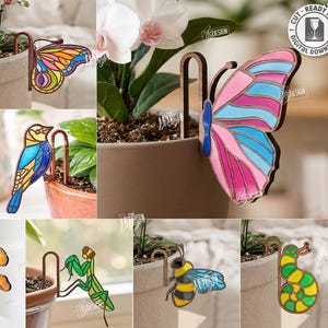 May include: A collection of colorful, laser-cut plant stakes in various designs, including a dragonfly, butterfly, frog, snail, bird, mushroom, praying mantis, bee, and a worm. The stakes are designed to be compatible with any material thickness. The image also includes the text "10 Designs" and "Cut Ready File".