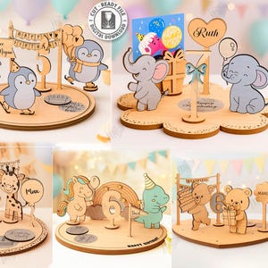 May include: Laser-cut wooden birthday decorations with animal characters, including penguins, elephants, giraffes, and bears. Each design includes a base, character figures, and decorative elements like banners and balloons. Suitable for laser cutting, with a material width of 3mm.