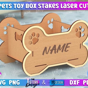 May include: Laser cut wooden dog bone shaped toy box with a slot for a name. The box is made of light brown wood and has a 3mm (1/8 inch) thickness.
