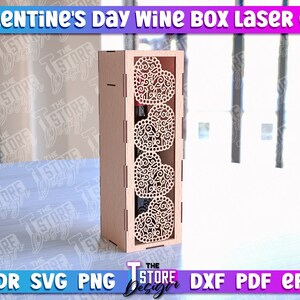 May include: A laser cut wooden wine box with a Valentine's Day theme. The box has a decorative design of four hearts with intricate details. The box is made of 3mm thick wood.