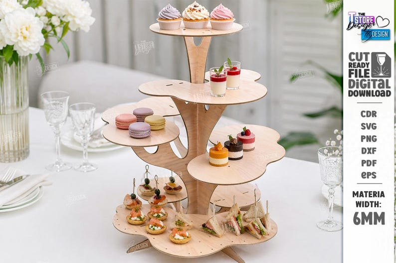 May include: A multi-tiered wooden dessert stand with a tree-like design, holding cupcakes, macarons, and mini desserts. The stand is made of light-colored wood and is filled with various treats. The text "CUT READY FILE DIGITAL DOWNLOAD" is visible.