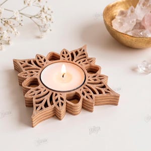 May include: A square wooden tea light candle holder with a laser-cut floral pattern and a lit white candle. The text on the right reads: The Store Design, Cut Ready File Digital Download, CDR, SVG, PNG, DXF, PDF, EPS, Compatible with any material thickness.