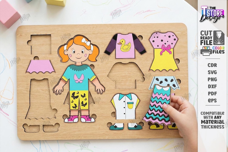 May include: Wooden puzzle with a girl figure and clothing pieces. Includes a teal top, pink skirt, yellow dress with a pink bow, and a blue and pink dress. The puzzle is compatible with any material thickness. The image also includes the text "CUT READY FILE".