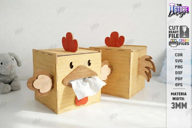 May include: Two wooden tissue box holders shaped like chickens. Each box has a red comb, a wooden beak, and a red wattle. The boxes are made of light-colored wood and have a 3mm width. The boxes are cut-ready files.