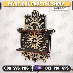 May include: Laser-cut wooden Mystical Crystal Shelf in the shape of a Hamsa hand. The shelf is black with gold accents and two shelves. The design includes a sun, moon, and floral patterns. The shelf is 6mm (1/4 in) thick.