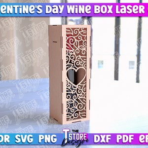 May include: Laser cut wine box with a heart-shaped cutout and intricate floral design. The box is made of wood and is ready to be assembled.