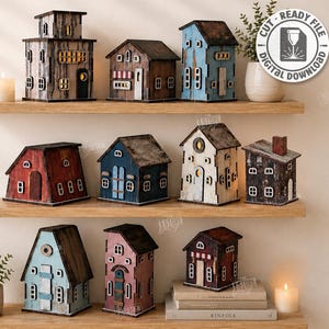 May include: A collection of ten miniature wooden house structures featuring various architectural styles, colors, and textures. The set includes digital files for laser cutting with a material width of 3mm, as indicated by the text on the right side.