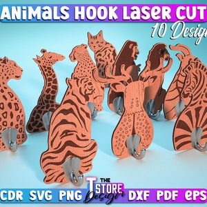 Könnte beinhalten: Zehn lasergeschnittene Tierhaken-Designs. Die Haken sind aus Holz und zeigen eine Vielzahl von Tieren, darunter eine Giraffe, ein Tiger, ein Hirsch, ein Zebra und ein Affe. Die Haken sind in Braun und Schwarz lackiert.