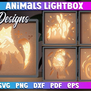 May include: Five lightbox designs featuring animals. The designs include a fox, a rabbit, a tiger, a parrot, and a cat. Each design is cut out of wood and illuminated from behind. The text "ANIMALS LIGHTBOX" and "5 Designs" is displayed at the top of the image. The text "SVG PNG DXF PDF EPS" is displayed at the bottom of the image.