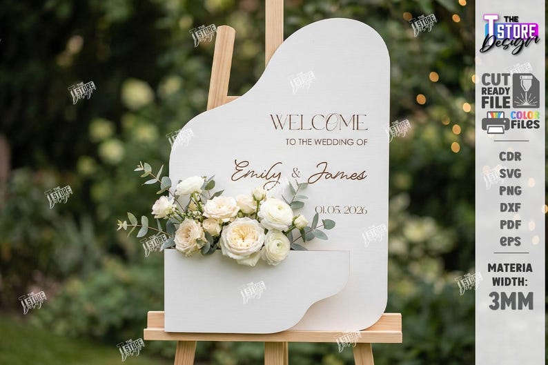 May include: A white wedding sign with a floral arrangement and the words "Welcome to the Wedding of Emily & James 01.05.2026". The sign is on a wooden easel. The sign is 3mm thick.