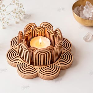 May include: A light brown wooden candle holder with a layered, arched, petal-like design surrounding a lit tea light candle. The text on the right reads: The Store Designer, Cut Ready File Digital Download, CDR, SVG, PNG, DXF, PDF, EPS, Compatible with any material thickness.